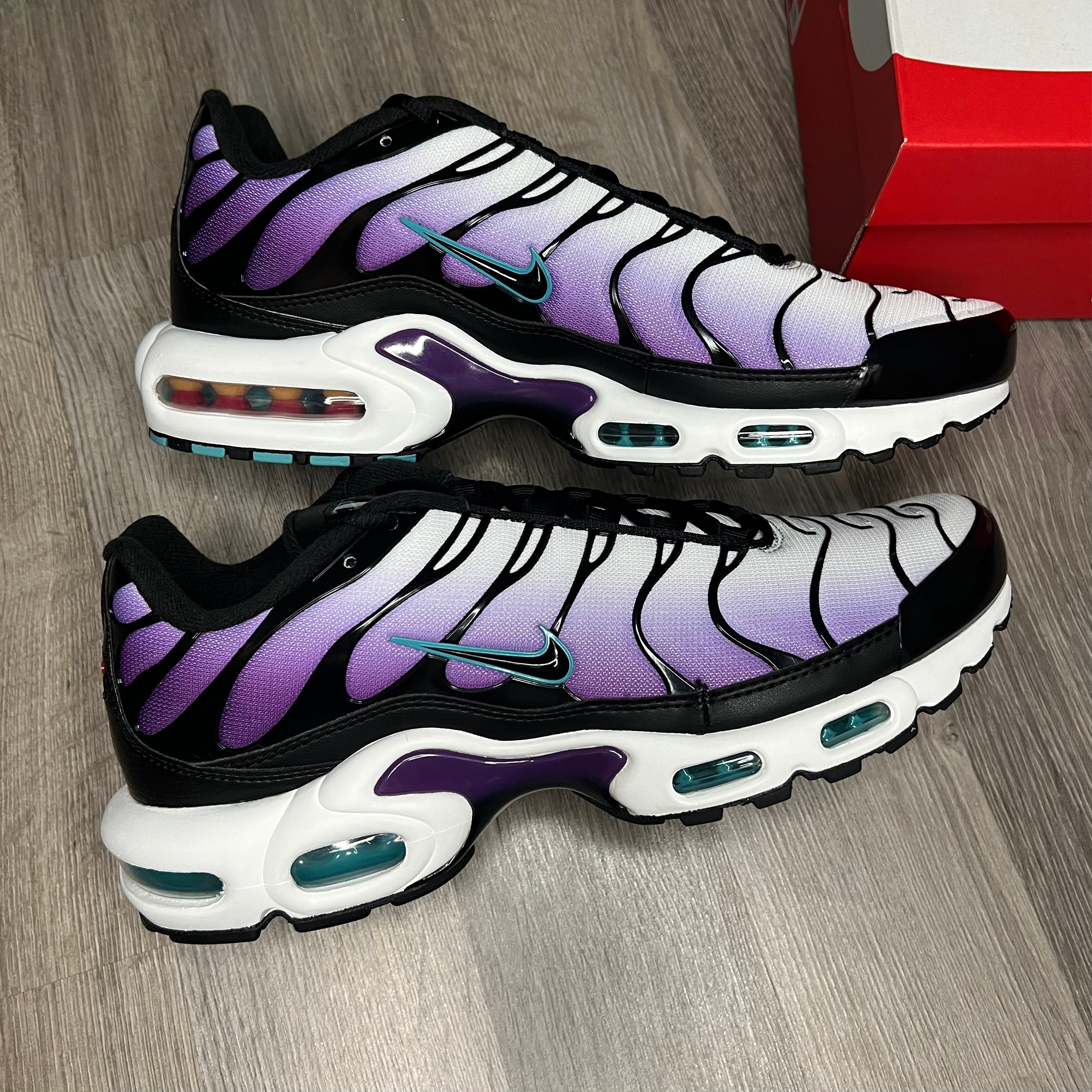 Black and purple nike air store max plus